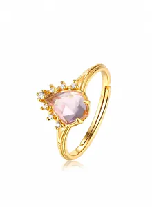 Detail of 9K gold plated ring featuring a pear-cut pink quartz and sparkling small diamonds