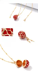 Macro detail of red enamel Fabergé egg pendant showing S925 hallmark and open design