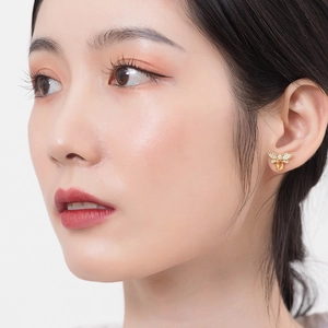 Citrine bee earrings in 925 sterling silver with gold plating worn by a model