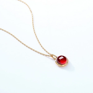S925 sterling silver gold plated necklace with round garnet pendant in a minimal bezel setting