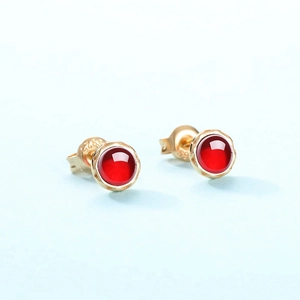 925 sterling silver gold plated stud earrings featuring round red garnet stones