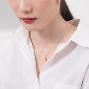 Close-up of S925 silver 9K gold plated necklace featuring a rhombus pink crystal pendant