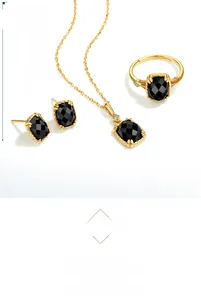 Detailed set of gold plated sterling silver jewelry featuring square black agate stones