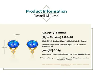 Macro detail of S925 gold plated stud earrings with 7x5mm blue opal and white zircon