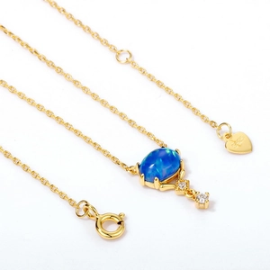 Collier vintage en argent S925 plaqué or avec opale bleue ovale et pendentifs zircon