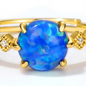 Elegant 9K gold plated S925 silver ring featuring a round blue opal and side diamonds