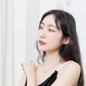 Elegant 9K gold-plated S925 silver jewelry set with blue opal on a model wearing black
