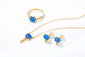 Detailed view of 9K gold plated S925 silver jewelry set featuring blue oval opal stones