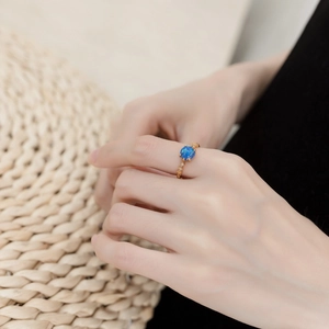 Elegant 9K gold plated S925 silver ring with blue opal and vintage hollow design