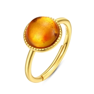 Detail of S925 silver gold-plated ring with round amber gemstone and inner stamp