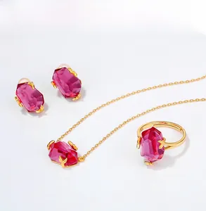 Close-up of geometric pink topaz pendant and earrings set with gold-plated sterling silver
