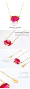 Macro detail of S925 sterling silver gold plated necklace with synthetic ruby pendant