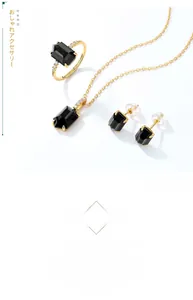 Close-up of black onyx jewelry set with rectangle cut stones and gold settings