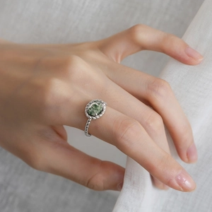 Retro S925 silver twist ring with natural green oval stone showing mossy texture