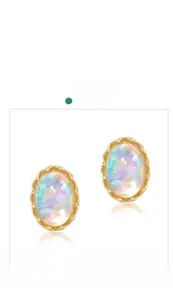 Close-up of vintage oval opal stud earrings with elegant gold plated 925 silver frames