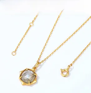 Detail of s925 gold-plated necklace with a faceted labradorite stone in hexagonal setting