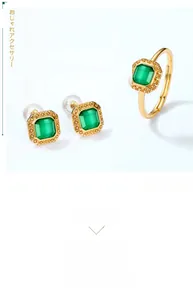 Close-up of vintage gold sterling silver jewelry set with green agate in square cut