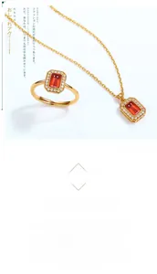 Close-up of a garnet ring and necklace set with white zircon halo on gold-plated silver