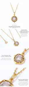 Detail view of gold-plated star pendant with natural labradorite gemstone and thin chain