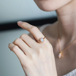 Detail of vintage oval opal ring and matching necklace set in gold-plated 925 silver