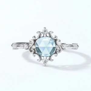 Vintage 925 silver crown ring with sky blue topaz and ornate floral filigree
