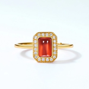 Vintage gold-plated ring featuring garnet main stone and micro-pave zircon halo design