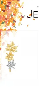 Close-up of maple leaf earrings in gold and silver finish with sparkling white zircon