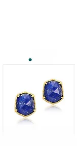 Macro shot of faceted blue lapis lazuli earrings with vintage gold vine metal frames