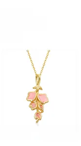 Macro detail of pink enamel flower petals with gold plating on a 925 silver ring