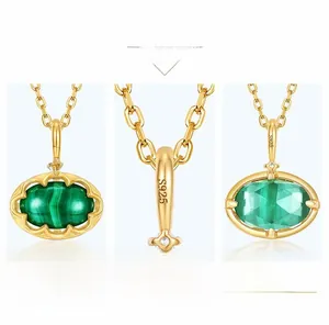 Detail of S925 silver 9K gold pendant with green malachite and reversible geometric design