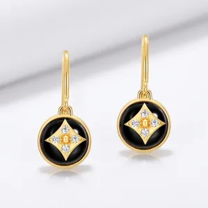 Elegant gold drop earrings with black onyx four-petal flower charm in S925 sterling silver