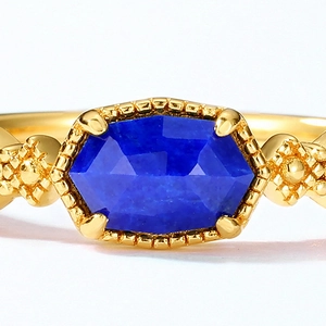 Macro detail of geometric lapis lazuli 925 silver ring with 10K gold plated bead edges
