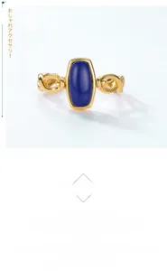 Close-up of rotatable gold ring with blue lapis lazuli and twisted rope band detail