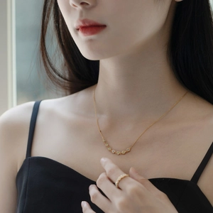Detail of S925 silver necklace and ring set with opal stones on a model