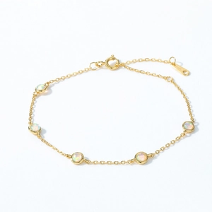 Elegant gold S925 silver bracelet featuring five round synthetic opal stones in minimalist style