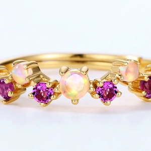 Elegant gold-plated wavy ring with pink opal and purple amethyst stones in claw setting
