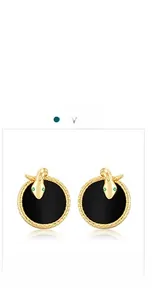 Detail view of gold serpent earrings featuring black agate inlay and sparkling green eyes
