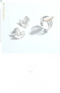 Detail showing tear-drop white shell inlay and ripple texture on S925 silver ring
