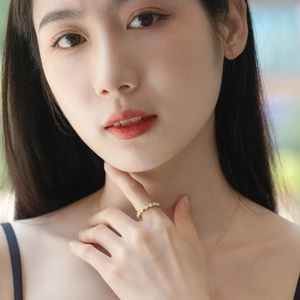 Elegant gold S925 silver opal ring and necklace set worn by a woman in natural light