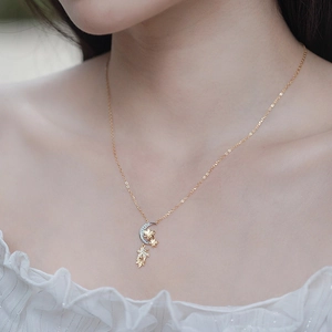 Elegant 925 silver necklace with gold crescent moon and maple leaf pendant on neck
