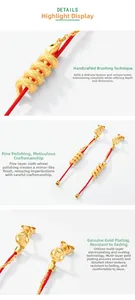 Macro detail of S925 silver snake earrings with gold plating and red cord accents