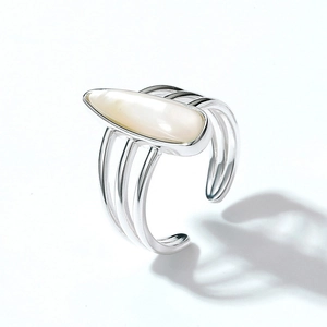 Detailed view of S925 silver ring featuring multi-layer bands and a white teardrop shell