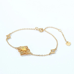 Detail of S925 silver gold-plated bracelet featuring geometric opal and pavé zircons