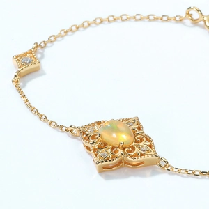 Elegant gold vintage geometric bracelet with oval opal inlay and zircon accents