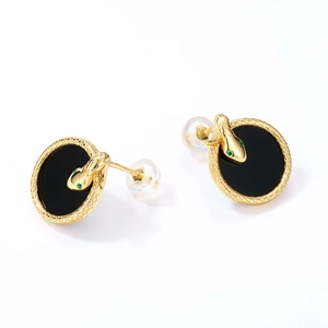 Gothic snake stud earrings with black onyx and green crystal eyes in gold plated silver