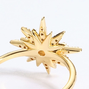 Star-shaped gold ring with opal and zircon featuring an intricate hollow honeycomb back