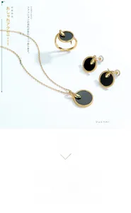 Detail of gold snake jewelry set with black onyx pendants including necklace and ring