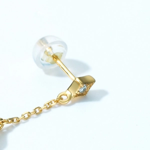 Elegant gold drop chain earrings with opal stone and diamond stud in geometric design