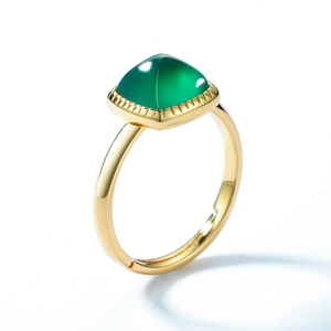 Detail of adjustable gold ring featuring a square cabochon green agate gemstone
