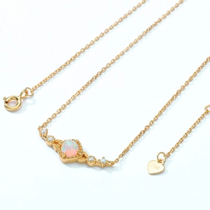 Elegant gold S925 sterling silver necklace featuring a round opal stone and zircon accents